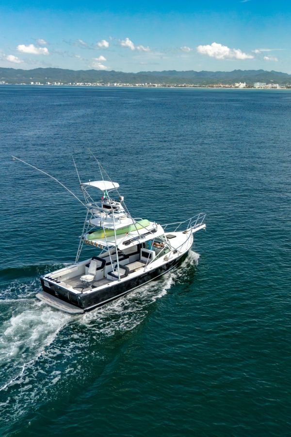 Guanatuna under way with the Puerto Vallarta coastline behind