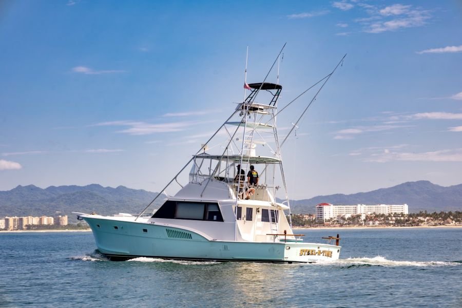 Steel n Time, our 53' Hatteras sport fisher, cruising past Puerto Vallarta