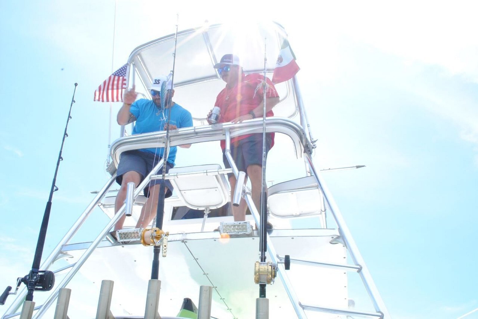Captain and mate working from the tuna tower on a fishing charter