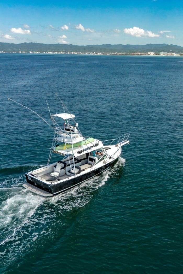 Guanatuna under way with the Puerto Vallarta coastline behind